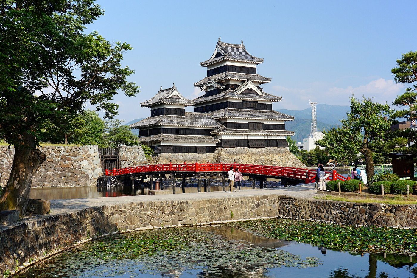 Matsumoto Castle: the black-lacquered tenshu above its moat, the northern Alps behind