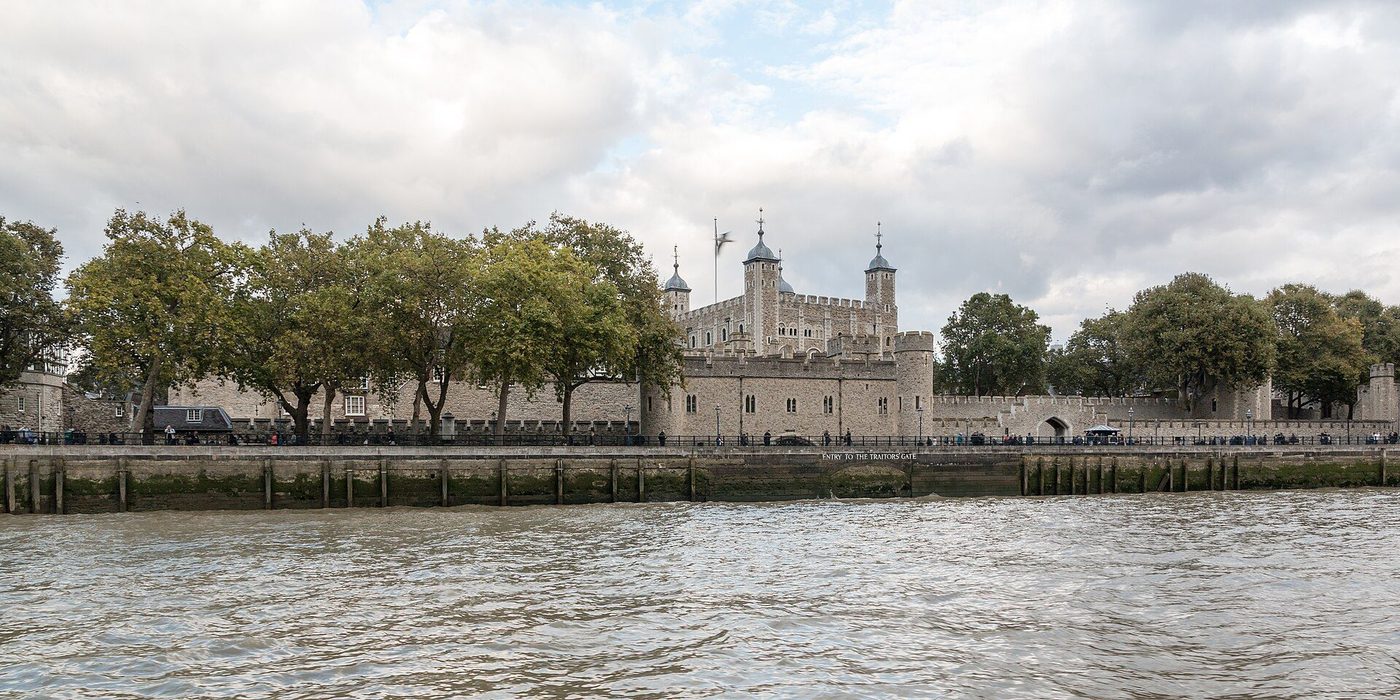 The Tower of London from the Thames: the White Tower rising inside the curtain walls along the river frontage
