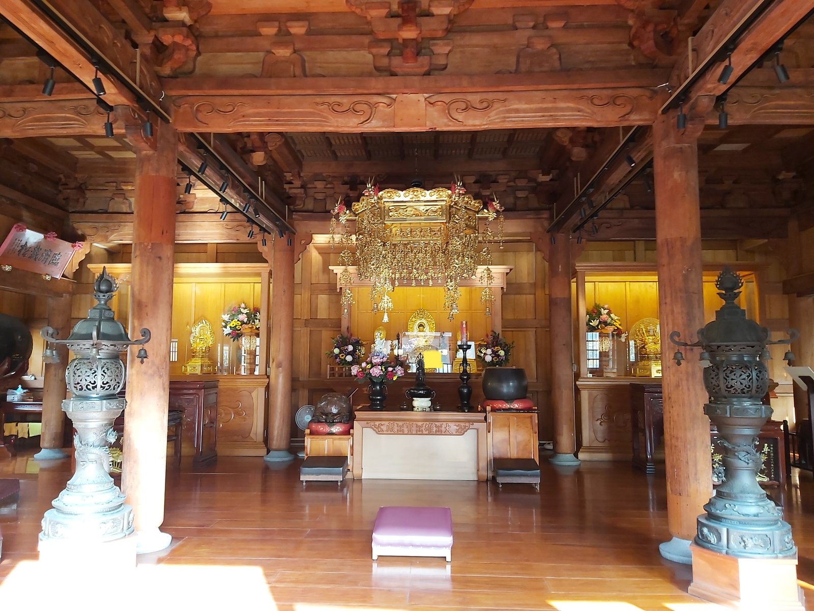 Inside the Mahavira Hall of Linji Huguo Chan Temple, its timber columns, altar and hanging lantern