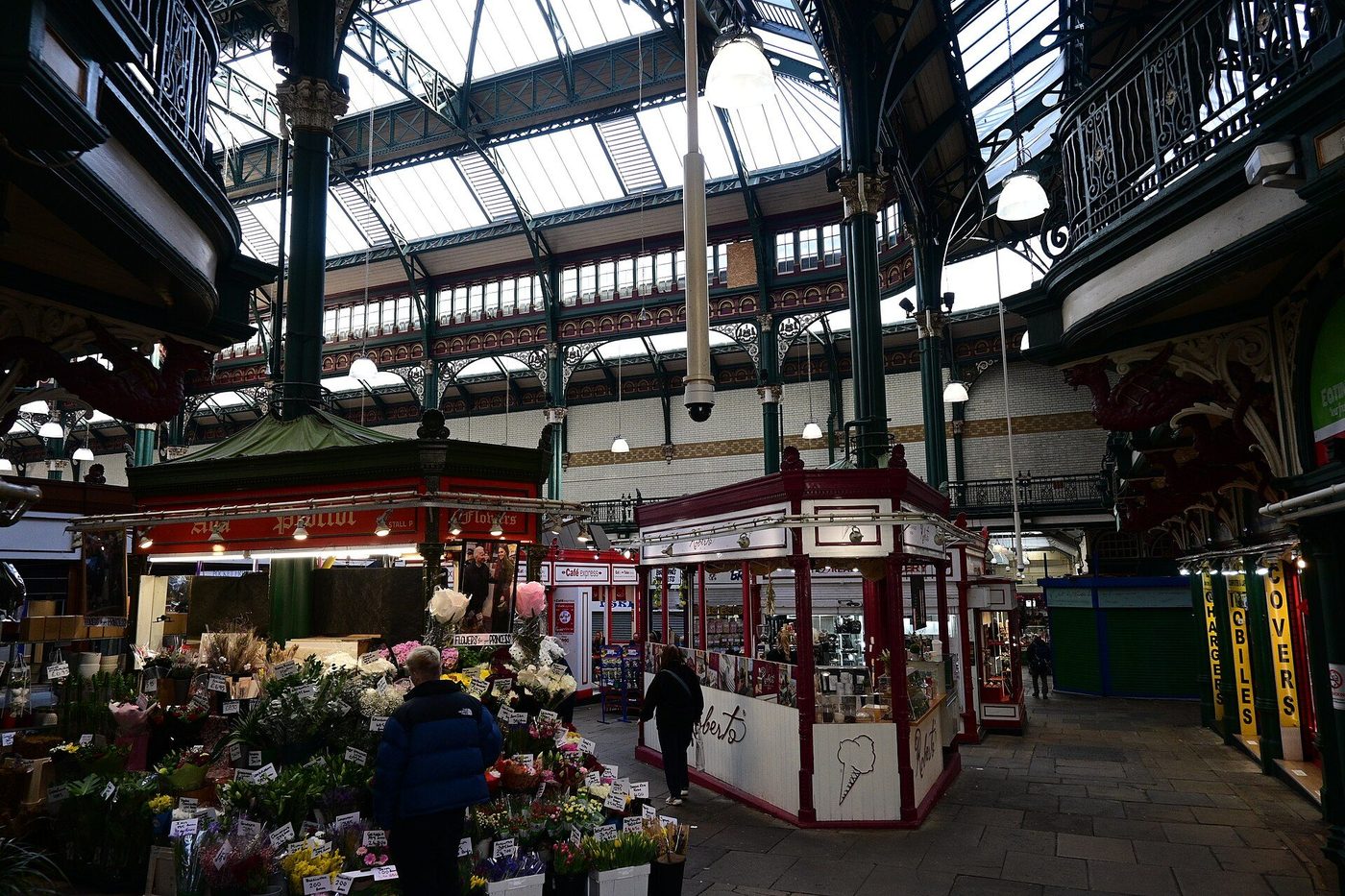 Slender cast-iron columns with ornate capitals inside Kirkgate Market, Leeds
