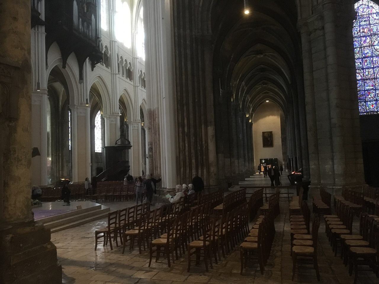 The nave of Chartres Cathedral, looking along the great vessel of stone and coloured light