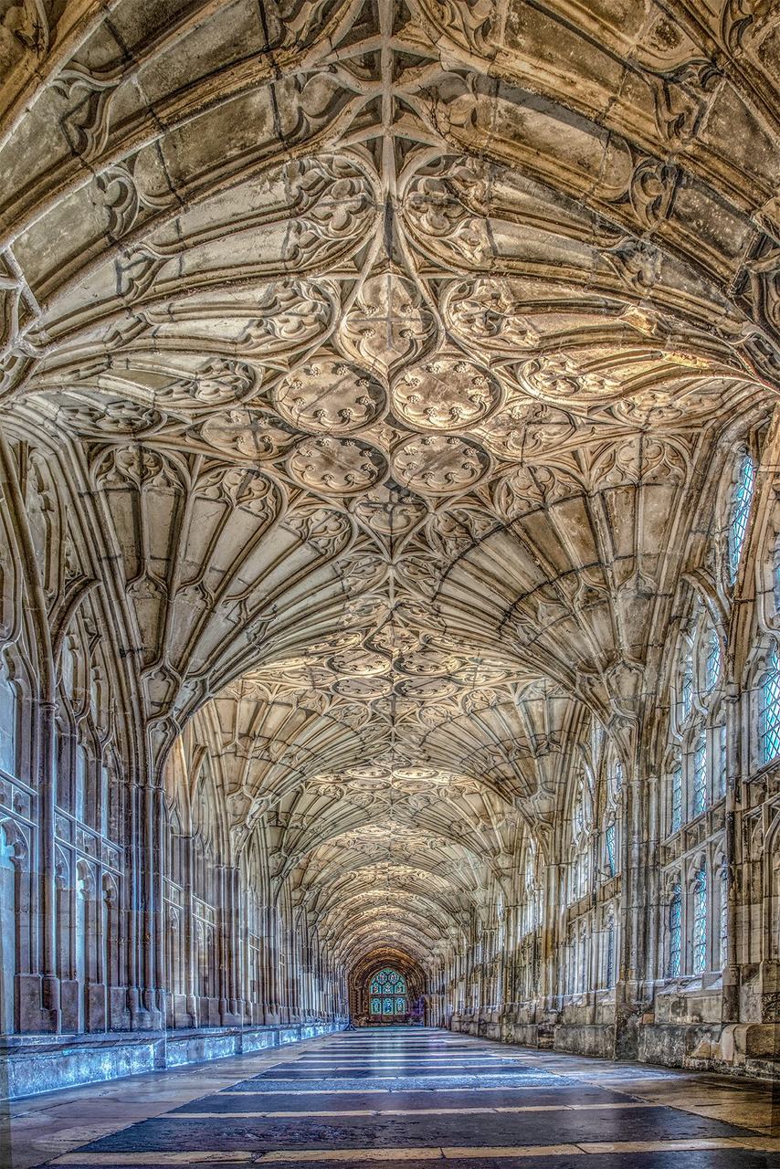 The east walk of Gloucester Cathedral's cloister, covered by the earliest surviving fan vaults