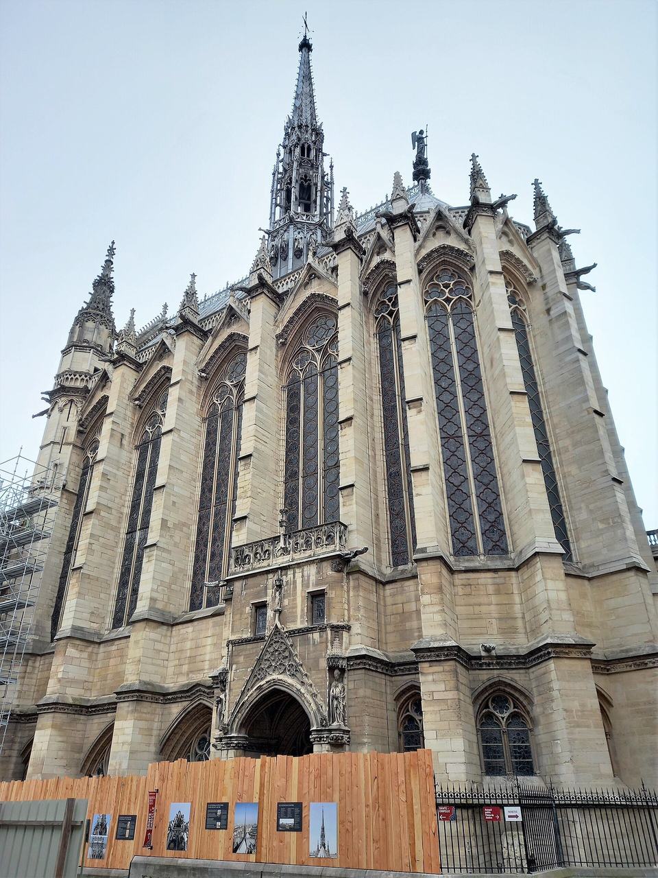 The Sainte-Chapelle in Paris from outside: tall traceried windows between buttresses, steep roof and flèche