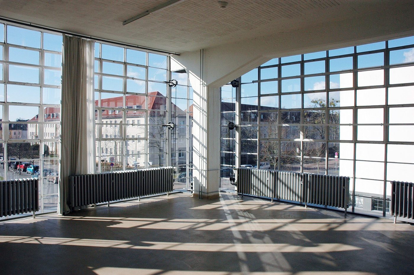 Inside the Bauhaus at Dessau: the workshop wing's glass curtain wall, hung from the frame and wrapping the corner