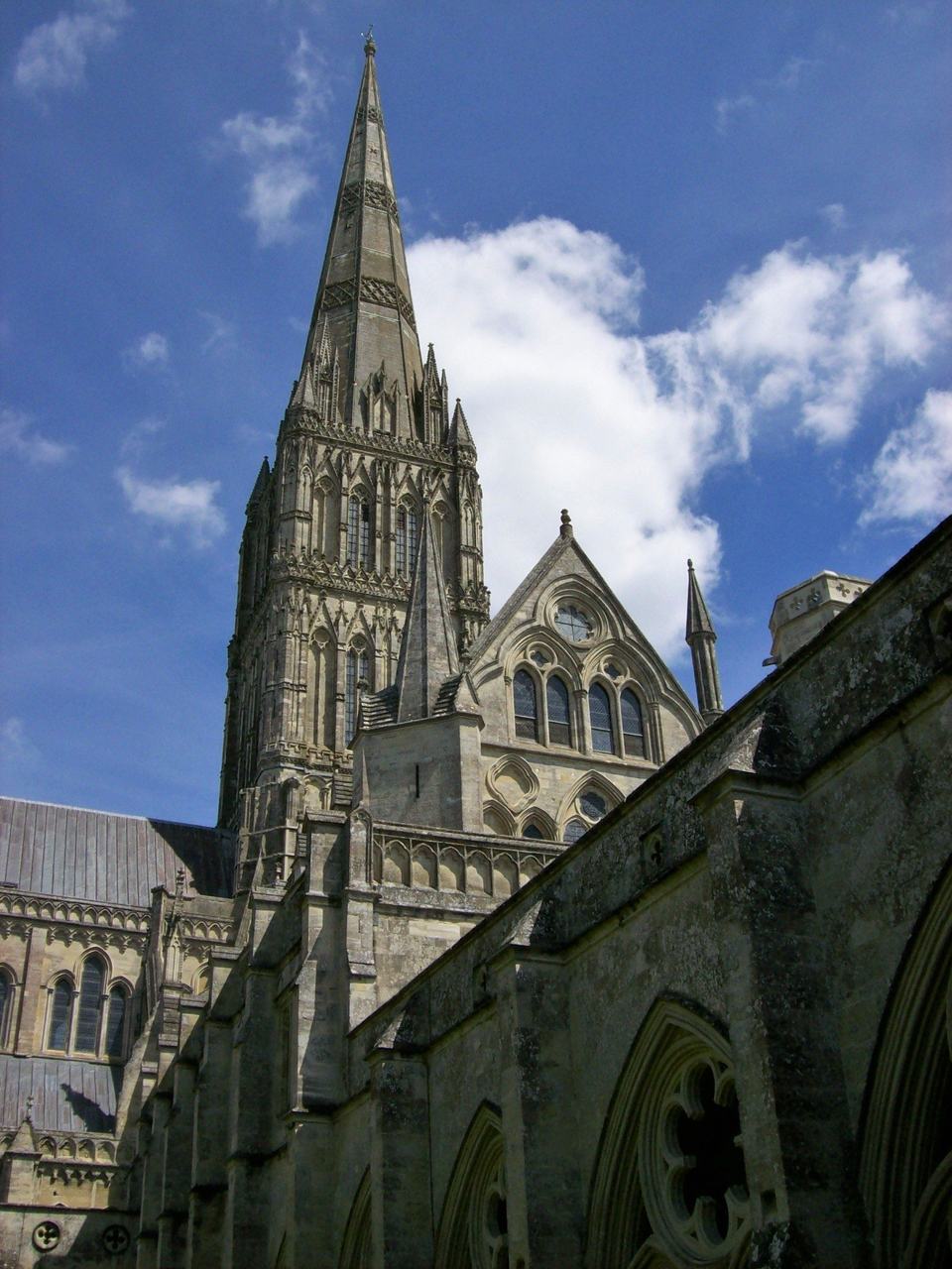 The spire of Salisbury Cathedral, the tallest in England, seen across the cloister garth