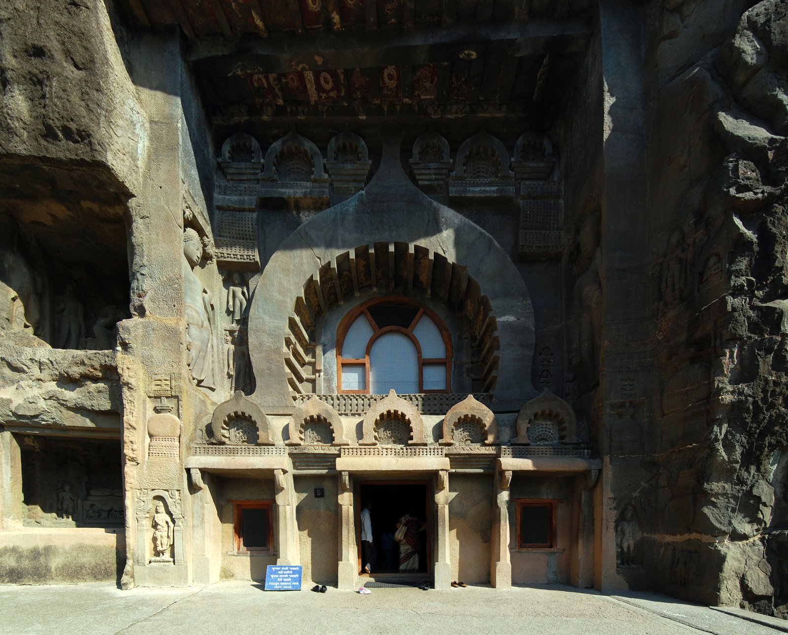The rock-cut facade of Cave 9 at Ajanta, its great arched chaitya window over the entrance