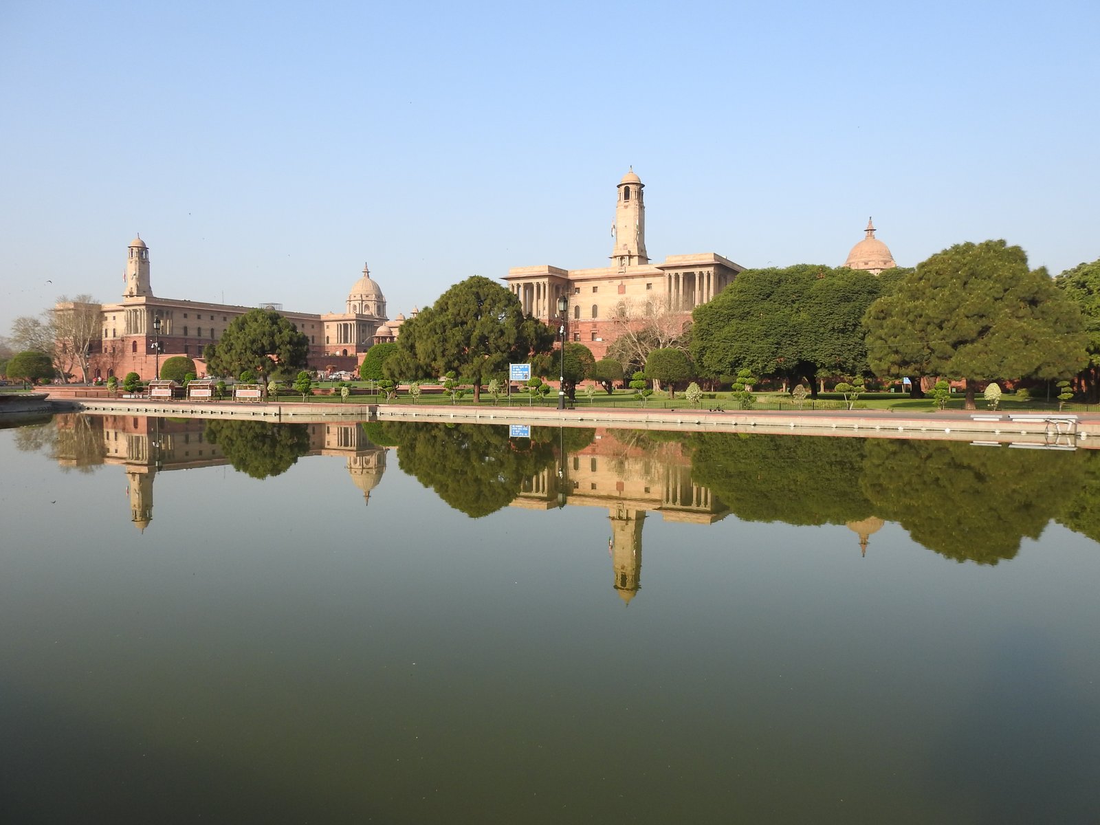 Rashtrapati Bhavan in New Delhi seen across its reflecting water, with Lutyens' secretariat ranges