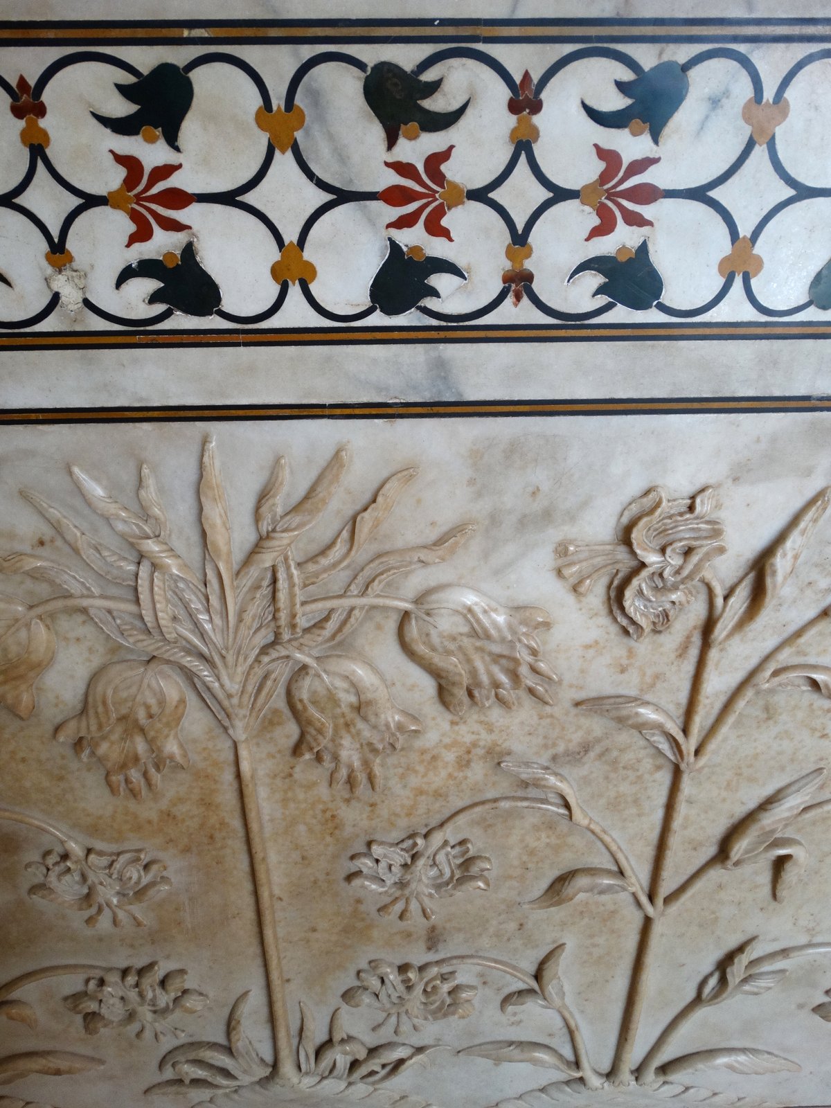 Pietra dura inlay and carved marble flowers on the Taj Mahal mausoleum