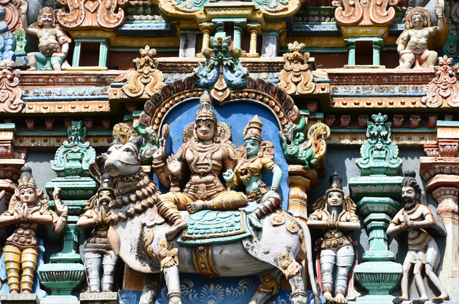Painted sculpture on a gopuram of Meenakshi Temple, Madurai, deities in bright colour