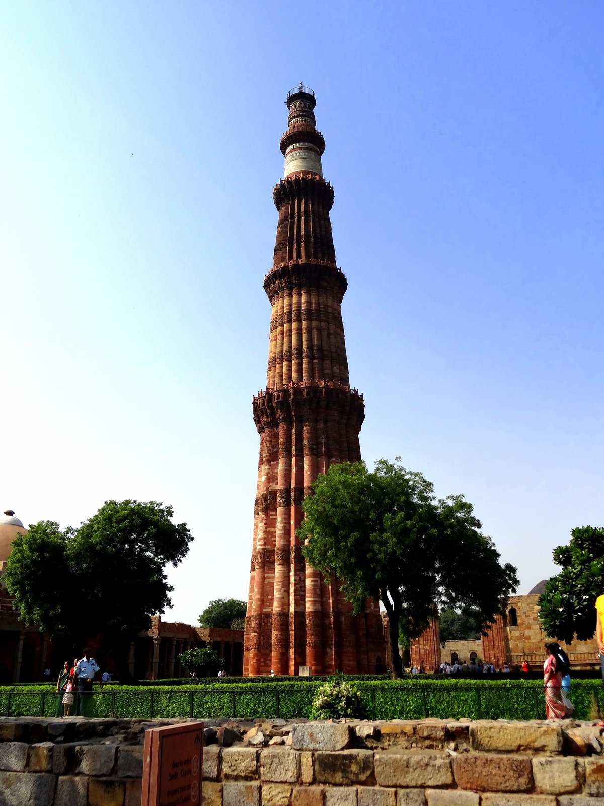 The Qutb Minar in Delhi, its tapering red sandstone tower rising over the complex