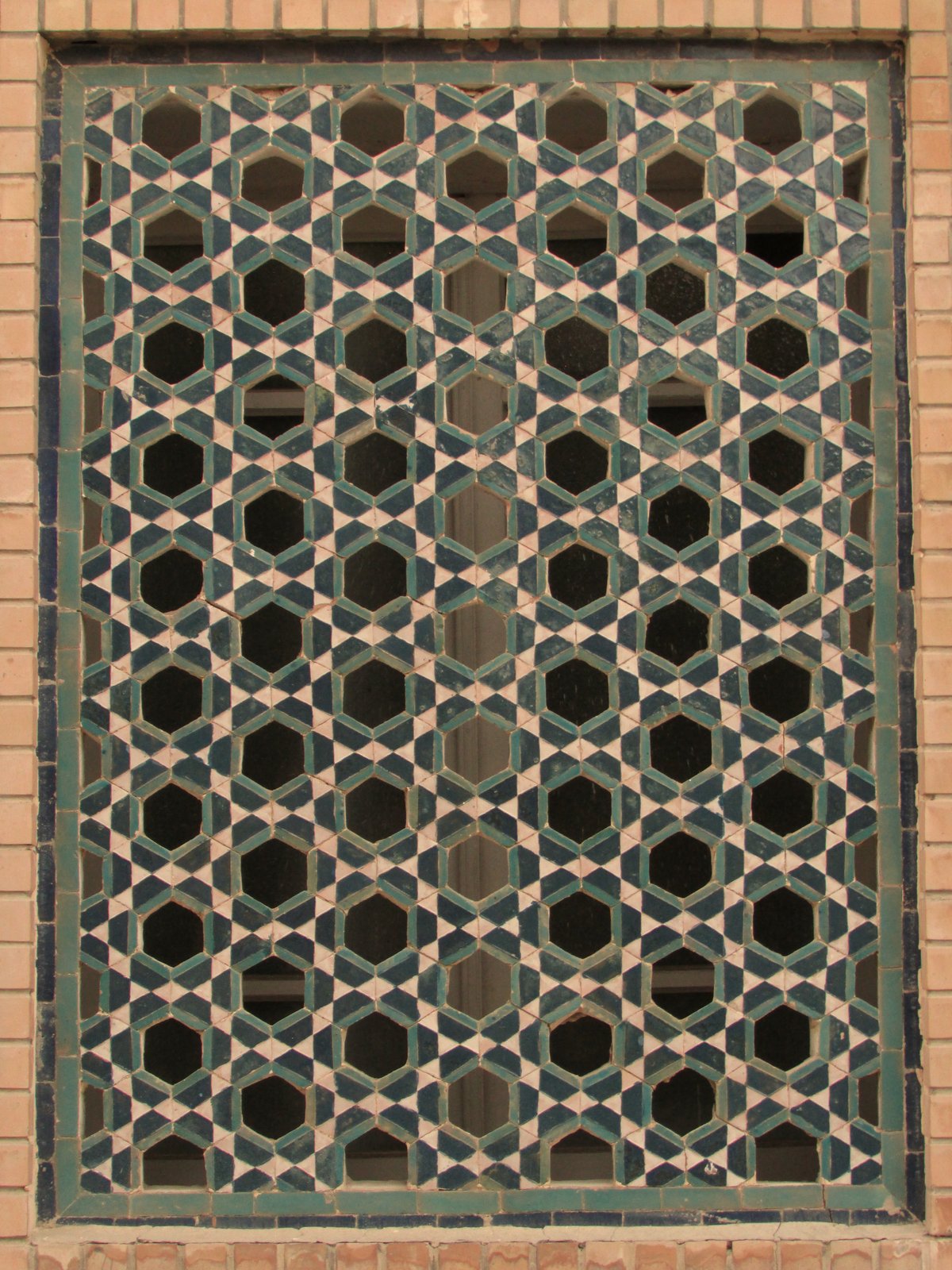 Geometric star-pattern tilework, its polygons and rosettes in glazed tile