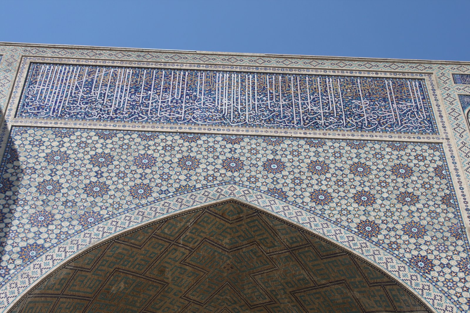 A great iwan, its vaulted recess opening onto a courtyard