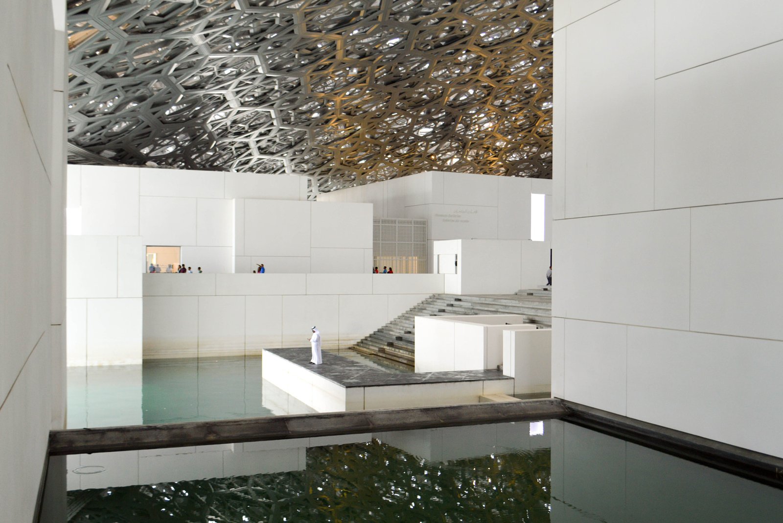 The perforated dome of the Louvre Abu Dhabi, filtering sunlight over its galleries