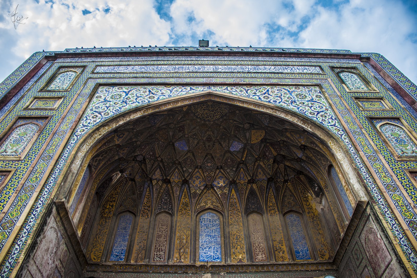 The tiled facade of the Wazir Khan Mosque in Lahore, its fresco and kashi-kari tilework