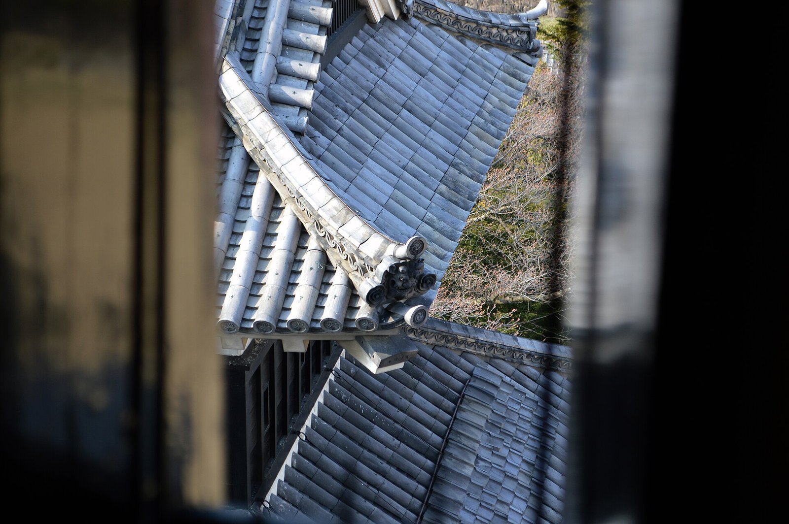Castle roof tiles seen from inside a tower window at Matsumoto Castle