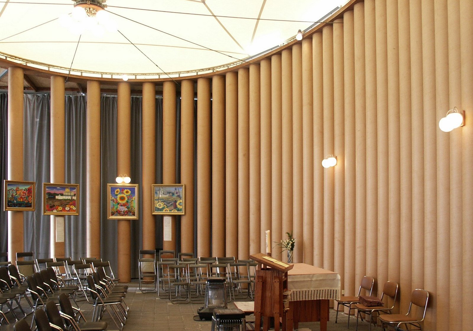 Inside the Paper Church in Kobe, its walls of paper tubes around the altar