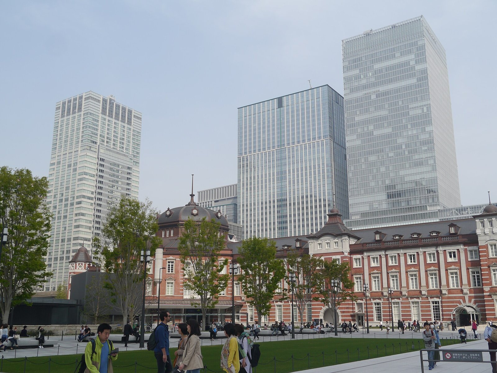 Tokyo Station's Marunouchi building, its red brick and domes among modern towers