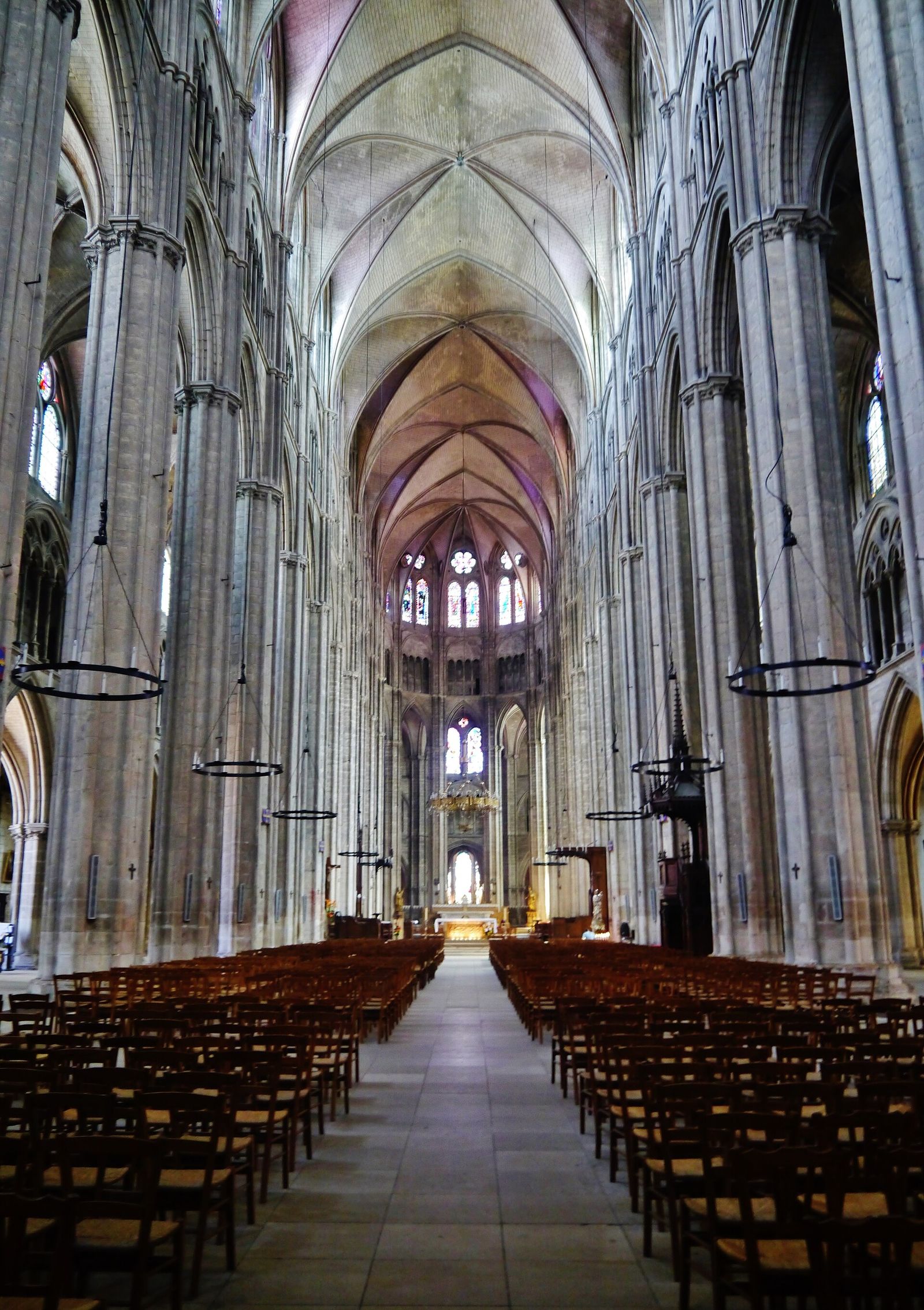 The nave of Bourges Cathedral looking east toward the lit choir