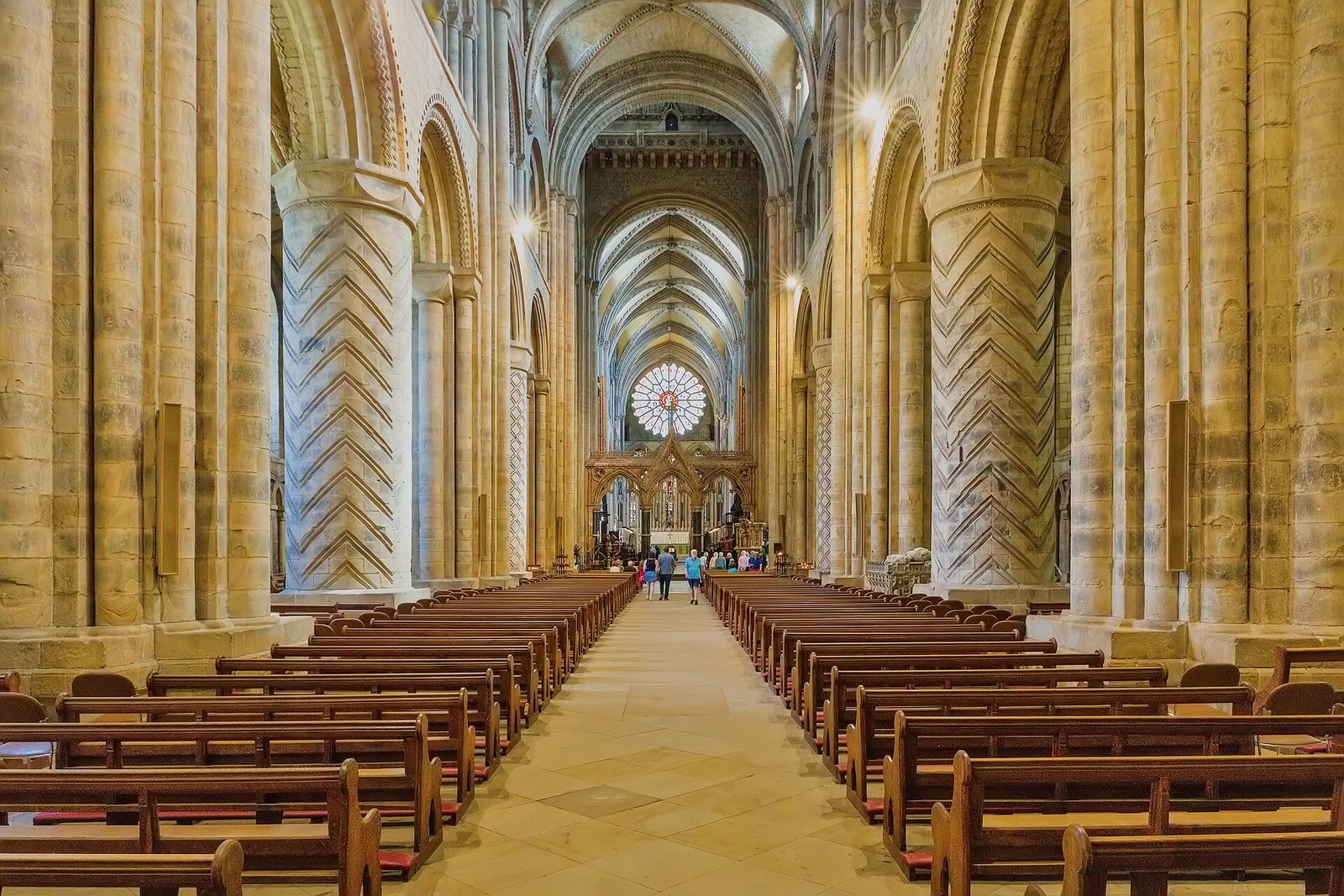 The nave of Durham Cathedral with its chevron-carved piers, looking east