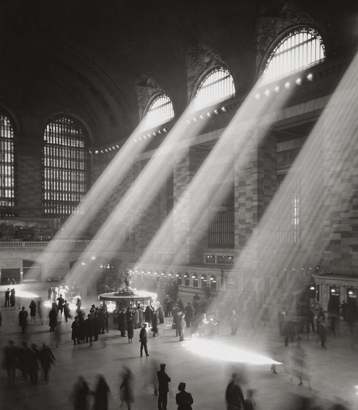 Sunbeams falling through the windows of Grand Central Terminal in New York, in a mid-20th-century photograph