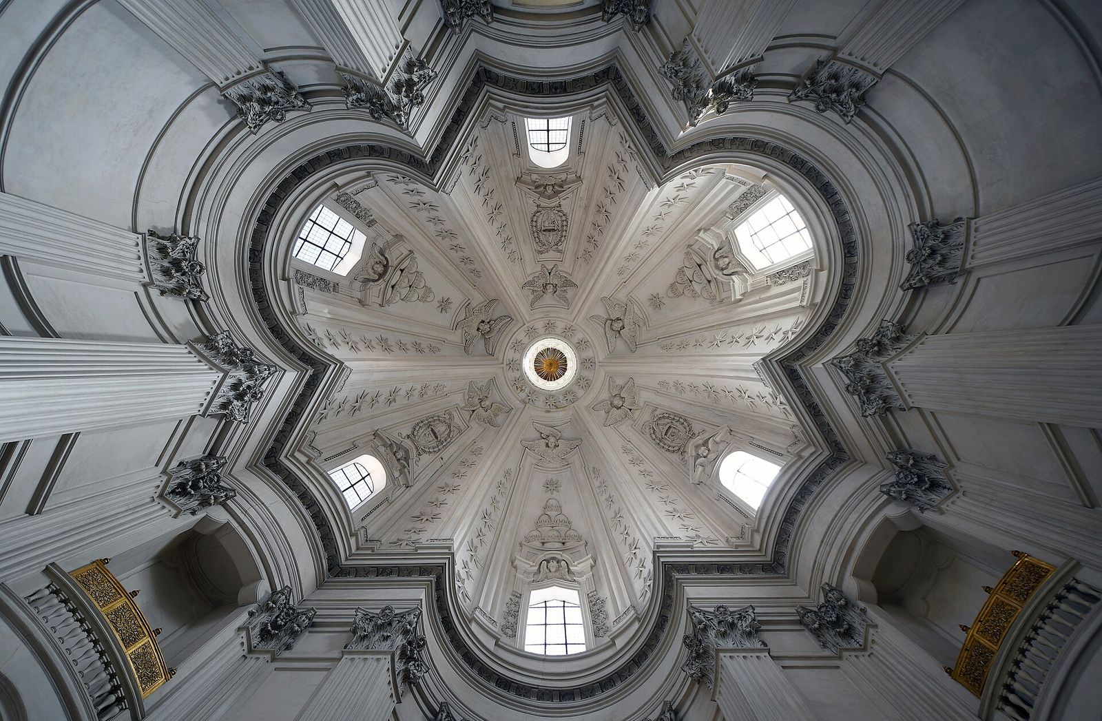 The dome of Sant'Ivo alla Sapienza in Rome from below, its windows set between the ribs