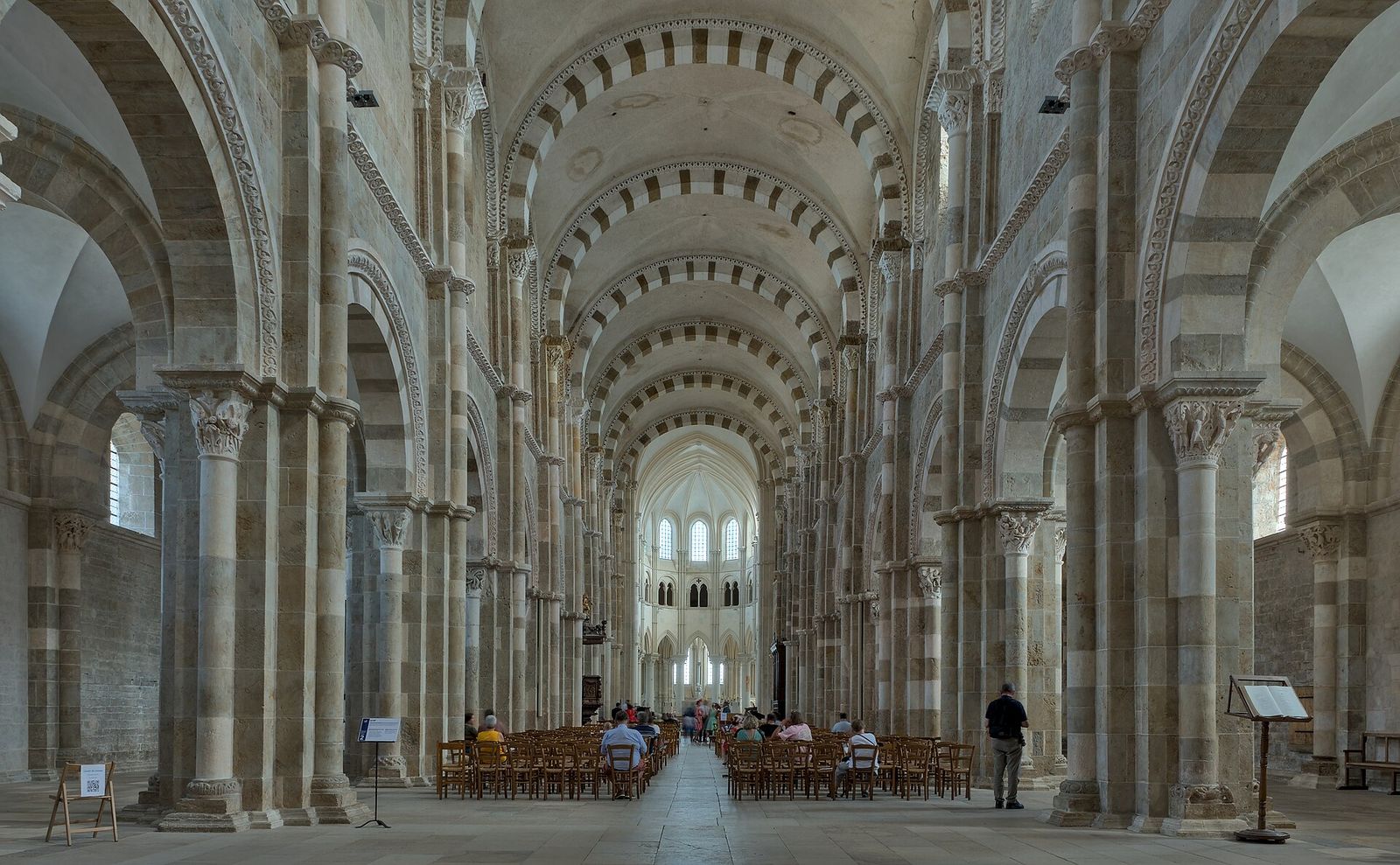 The nave of Vézelay basilica with its alternating banded arches, looking toward the choir