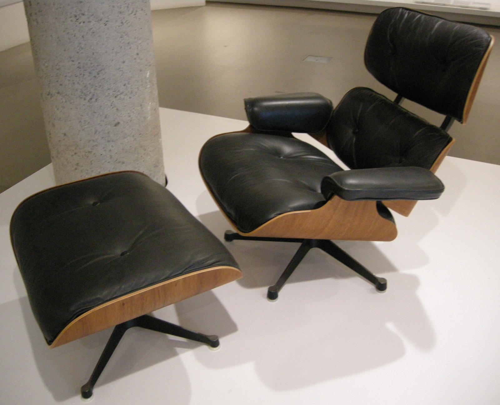 The Eames Lounge Chair and ottoman in black leather and moulded rosewood