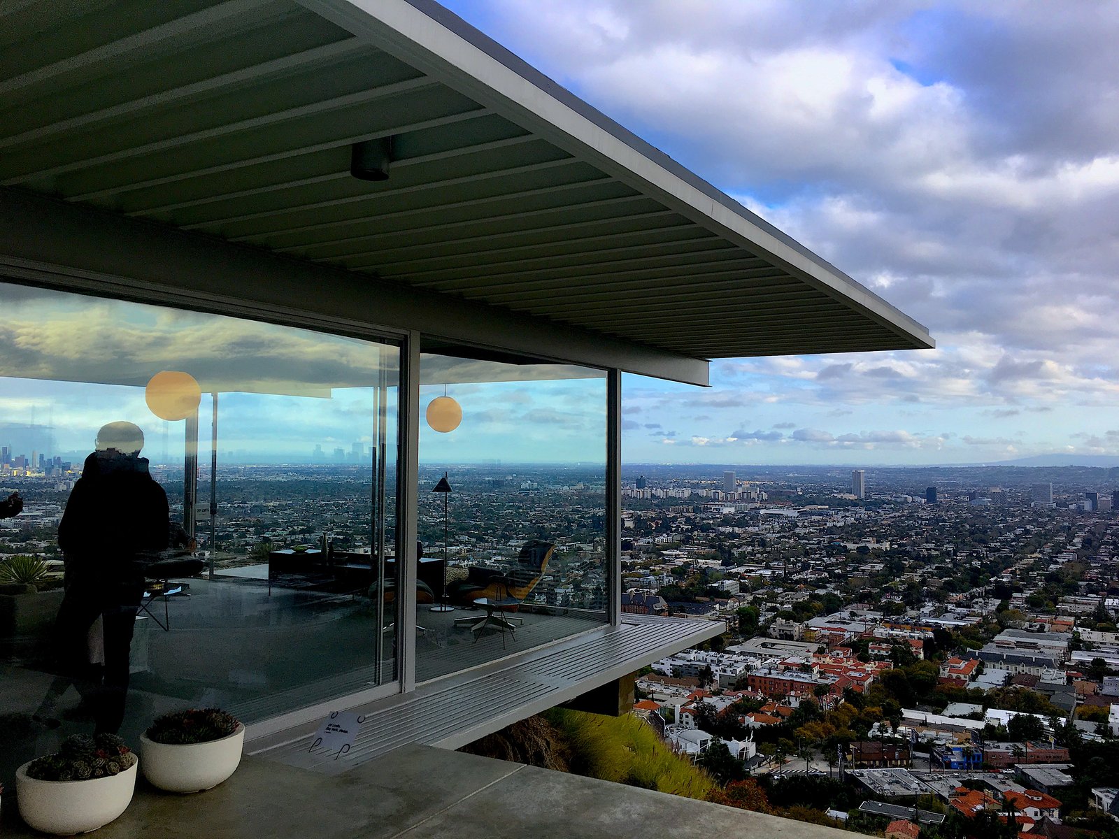 The Stahl House in Los Angeles, its glass living room cantilevered over the city at dusk