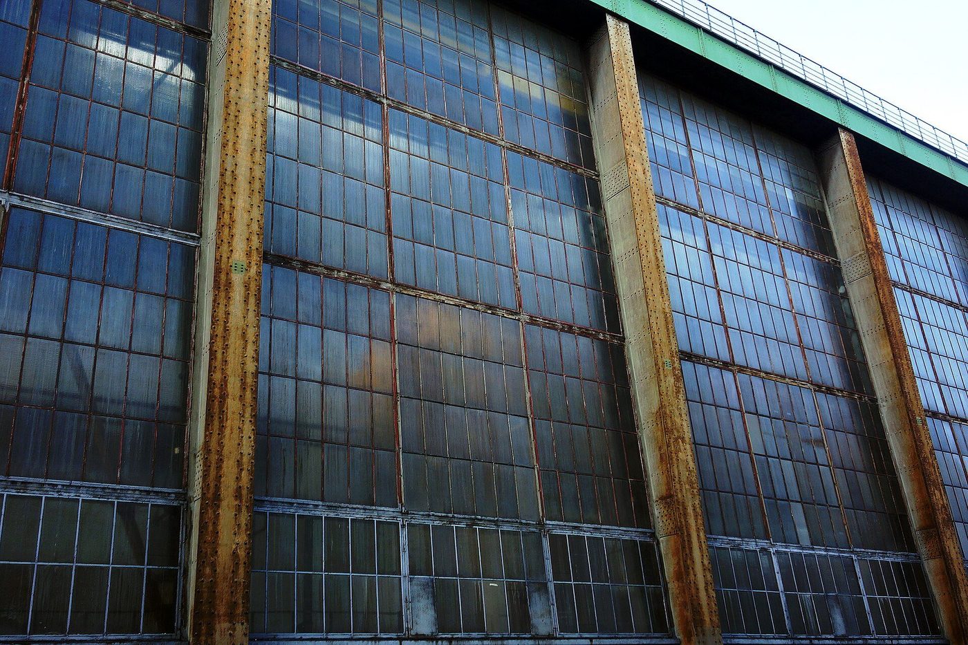 The glazed gable end of the AEG Turbine Hall in Berlin-Moabit, its steel frame filled with glass