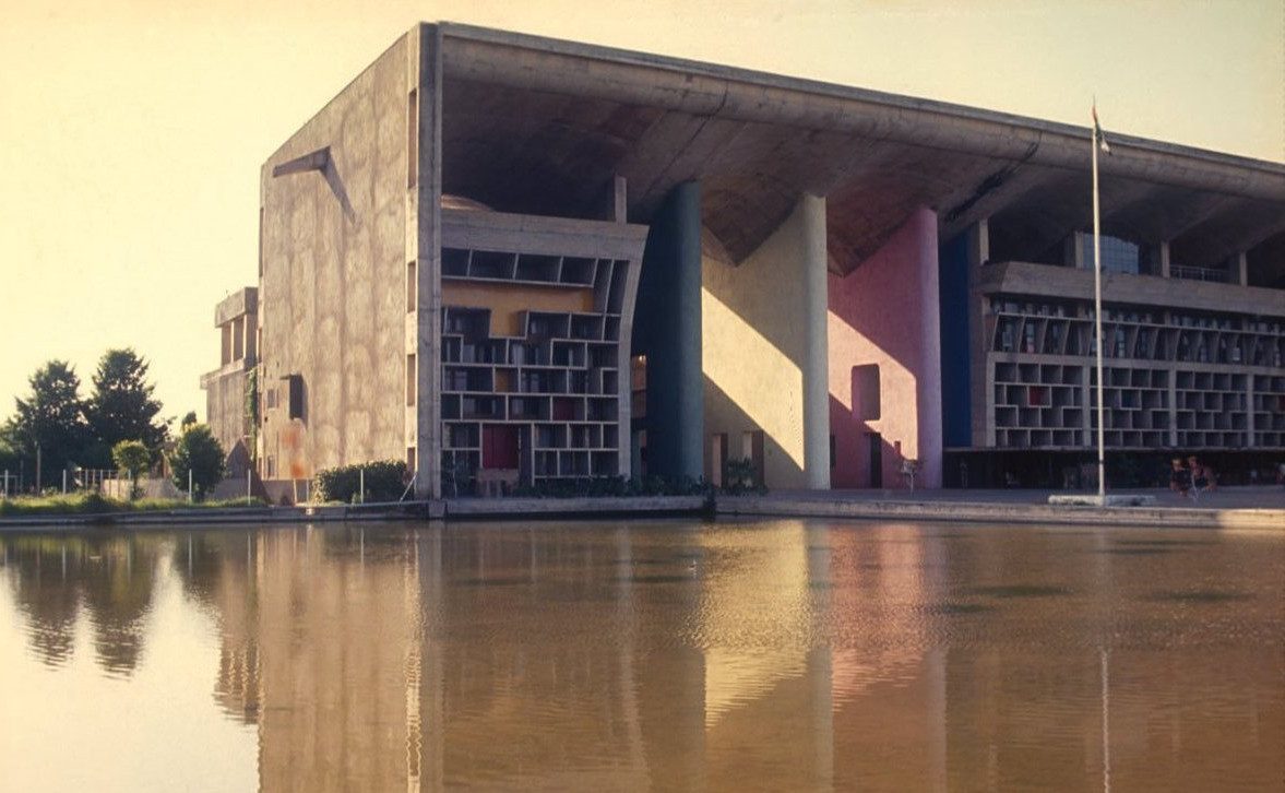 The High Court at Chandigarh across its reflecting pool, its vaulted parasol roof and coloured reveals