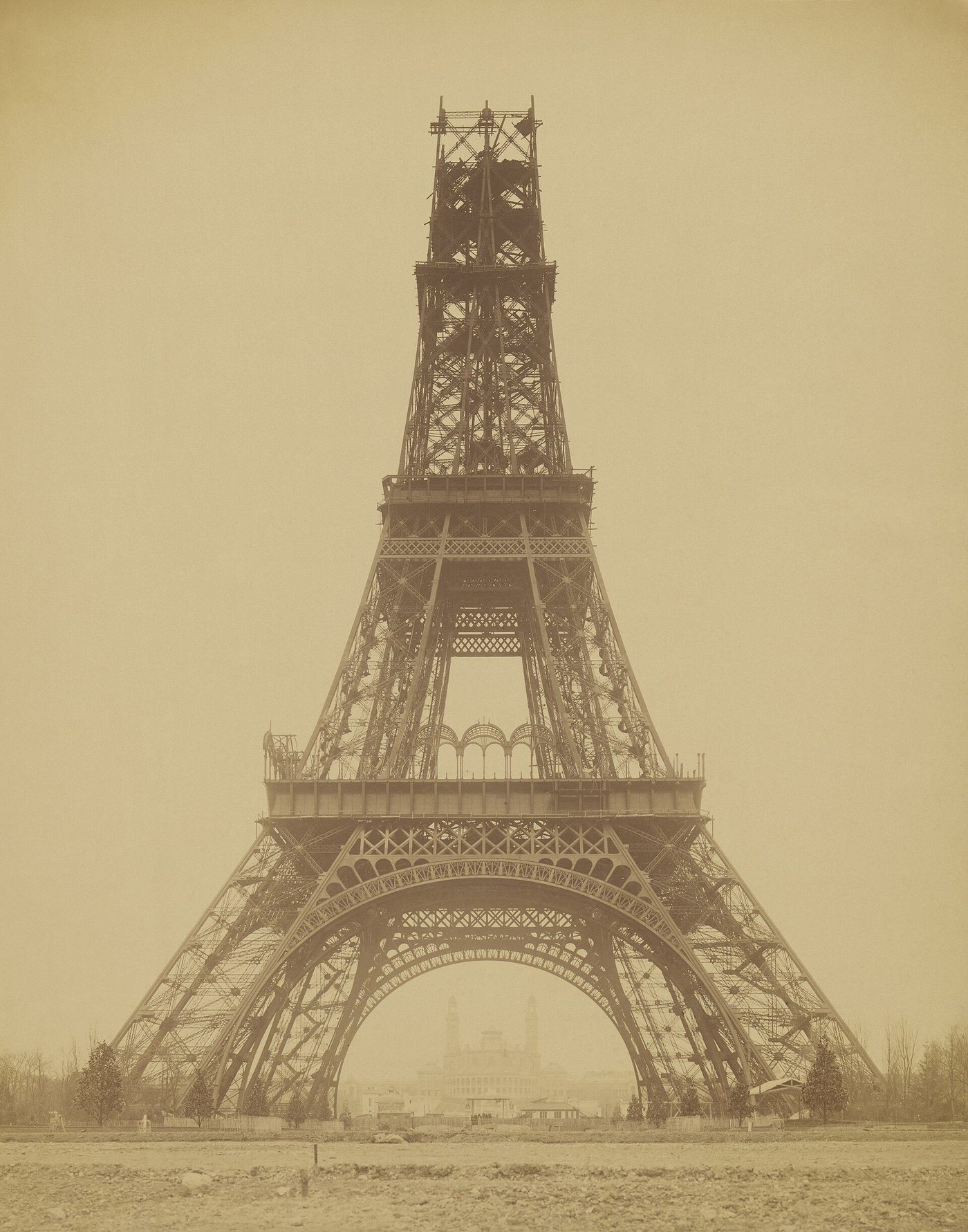 Durandelle's 1888 photograph of the Eiffel Tower under construction, its four legs joined and the shaft rising