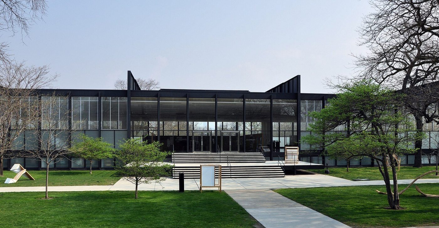 Crown Hall at IIT, Chicago: a black steel and glass pavilion across the lawn