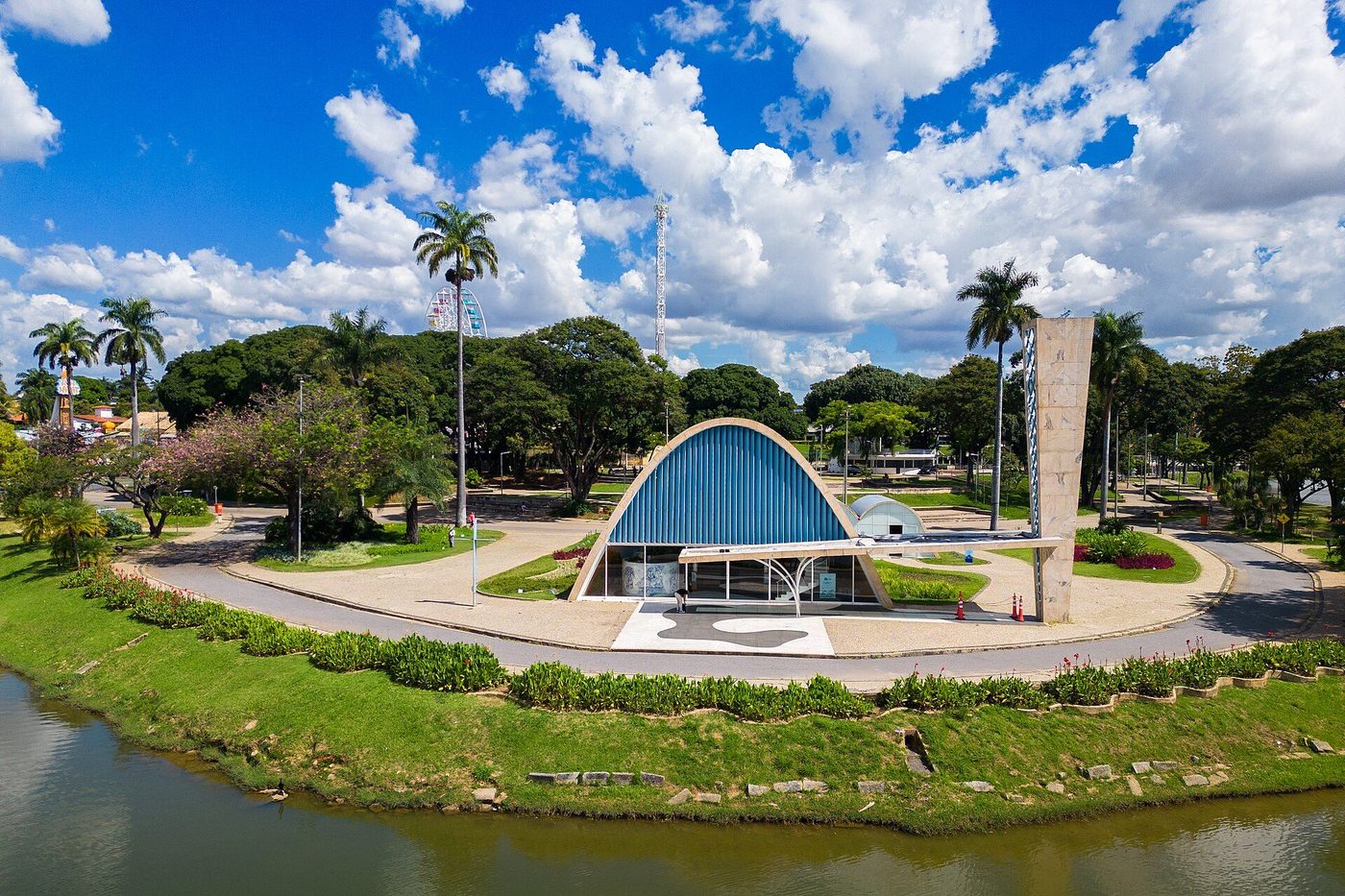 The Church of São Francisco at Pampulha beside its lake: a blue parabolic vault and slender tower