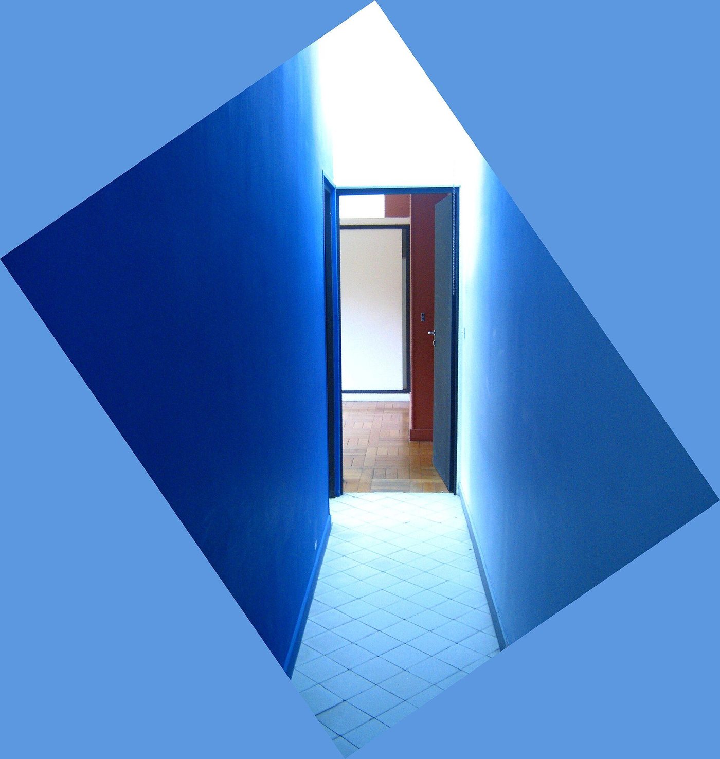 Inside Villa Savoye: the blue-painted ramp hall, a wall of colour lit from above