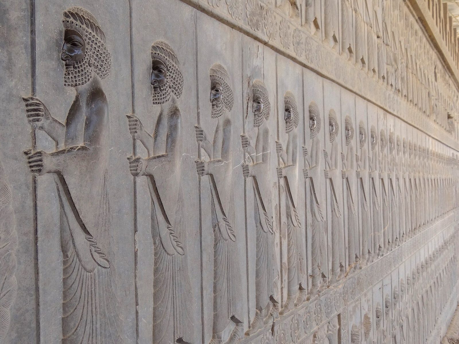 Bas-relief on the Apadana staircase at Persepolis: a procession of Persian guards in carved stone