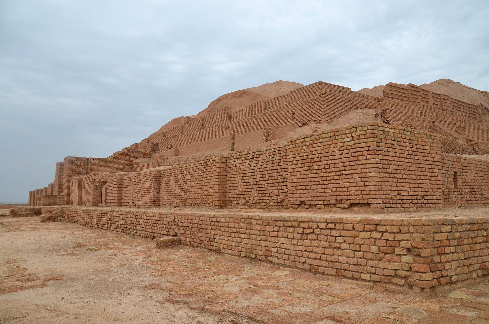 The ziggurat of Chogha Zanbil from the east: the stepped mass of baked brick above its enclosure