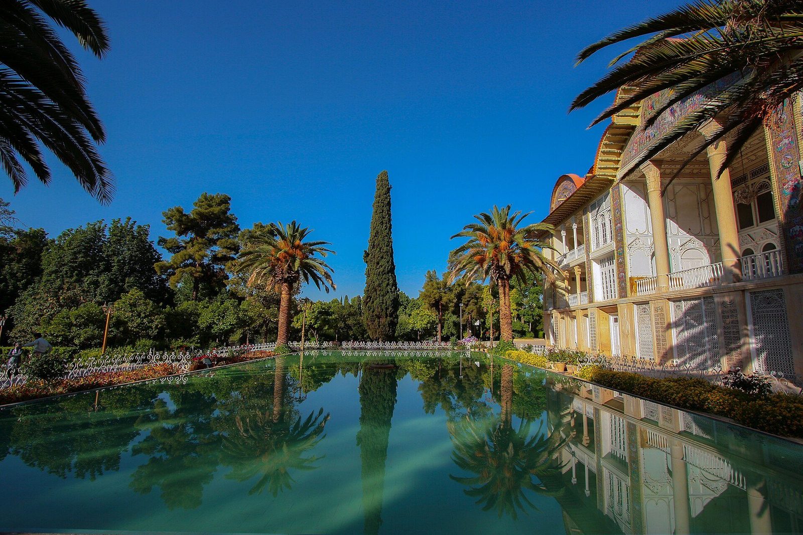 Eram Garden in Shiraz: the long pool reflecting the Qavam pavilion and the garden's cypresses and palms