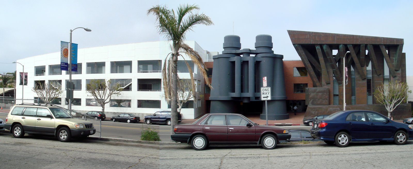 The Chiat/Day Building in Venice, California, with its giant dark grey binoculars sculpture standing in front of the white office block.