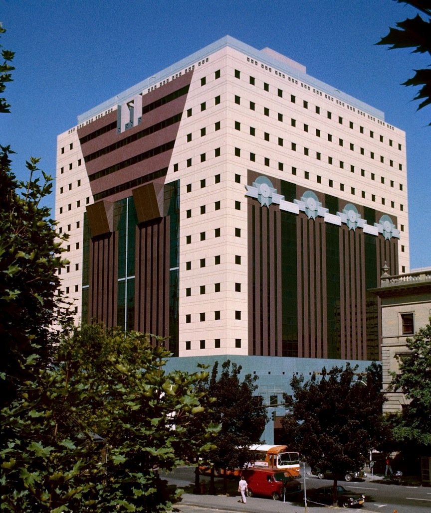 The Portland Building in Portland, Oregon, in 1982 shortly before it opened, showing its blue-tiled facade and giant pilasters.
