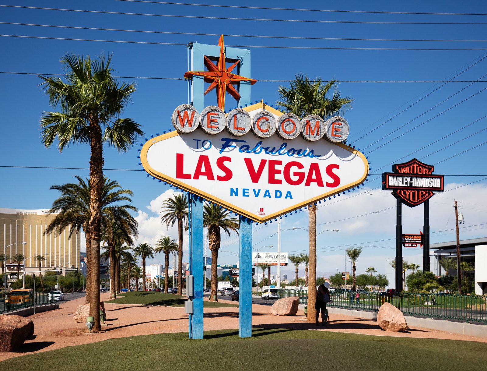 The Welcome to Fabulous Las Vegas sign in Nevada, its diamond-shaped sign on blue posts between palm trees.
