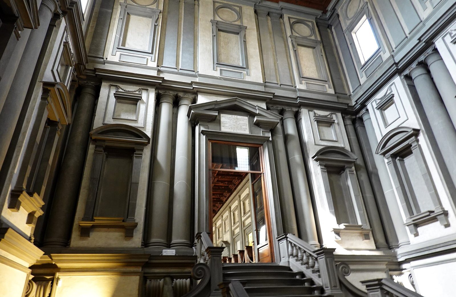 The vestibule of the Laurentian Library in Florence, its staircase flowing down between columns