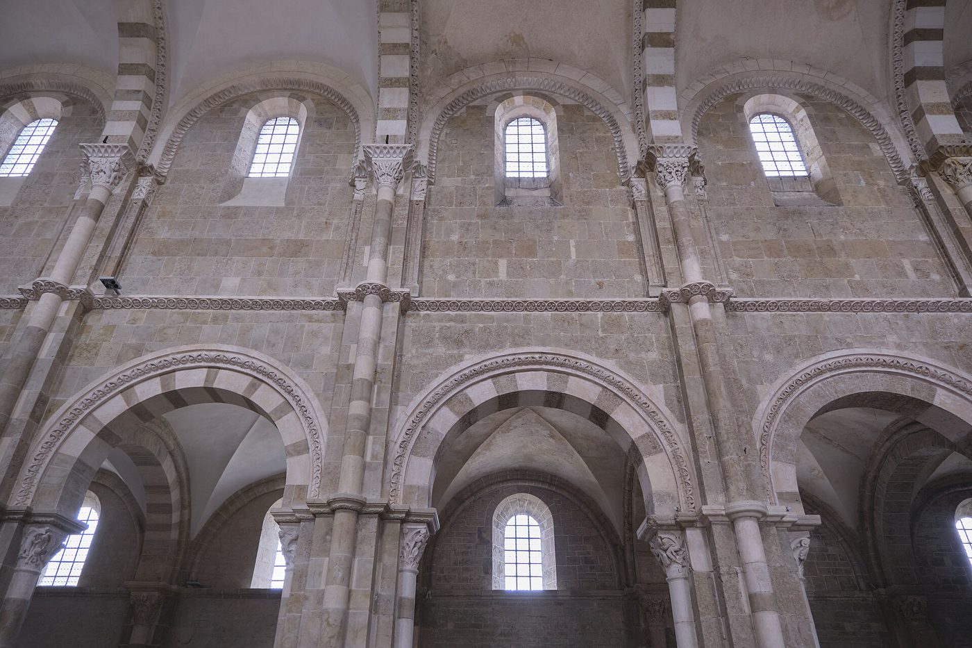 The nave elevation of Vézelay basilica: arcade, gallery and clerestory with striped arches