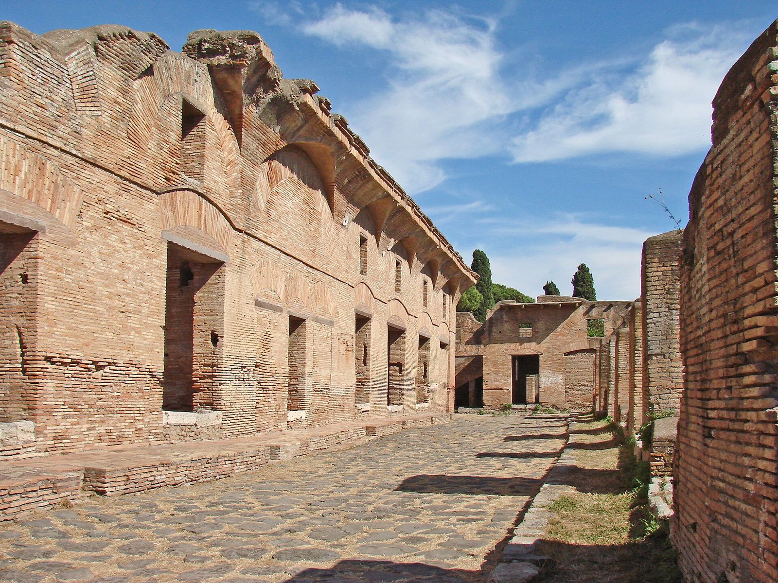 The brick street front of the House of Diana, an insula apartment block at Ostia Antica