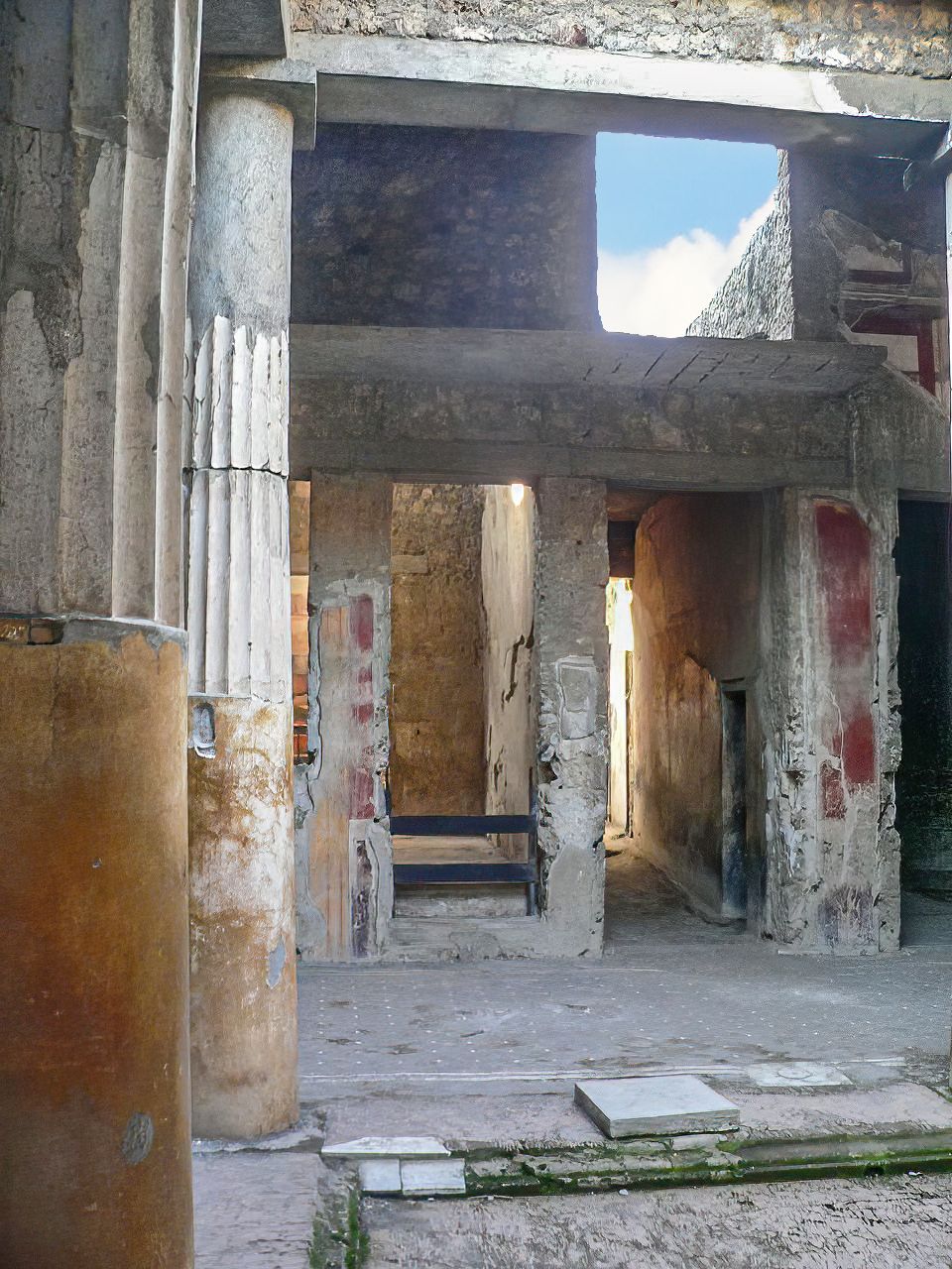 The columned atrium of the House of the Ceii at Pompeii, open to the sky at the compluvium