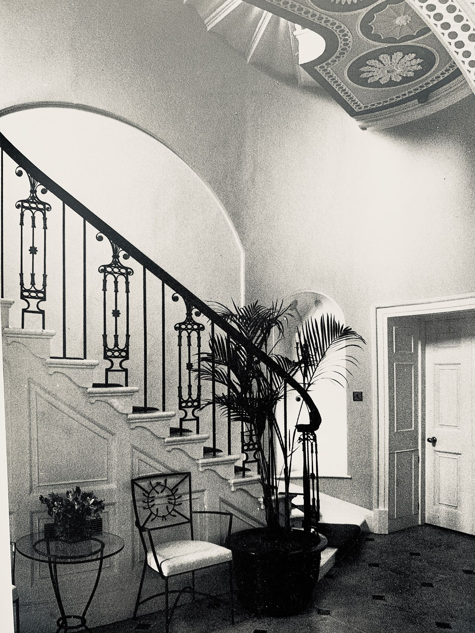 The entrance hall and staircase of 1 Bedford Square, London, in a black-and-white photograph
