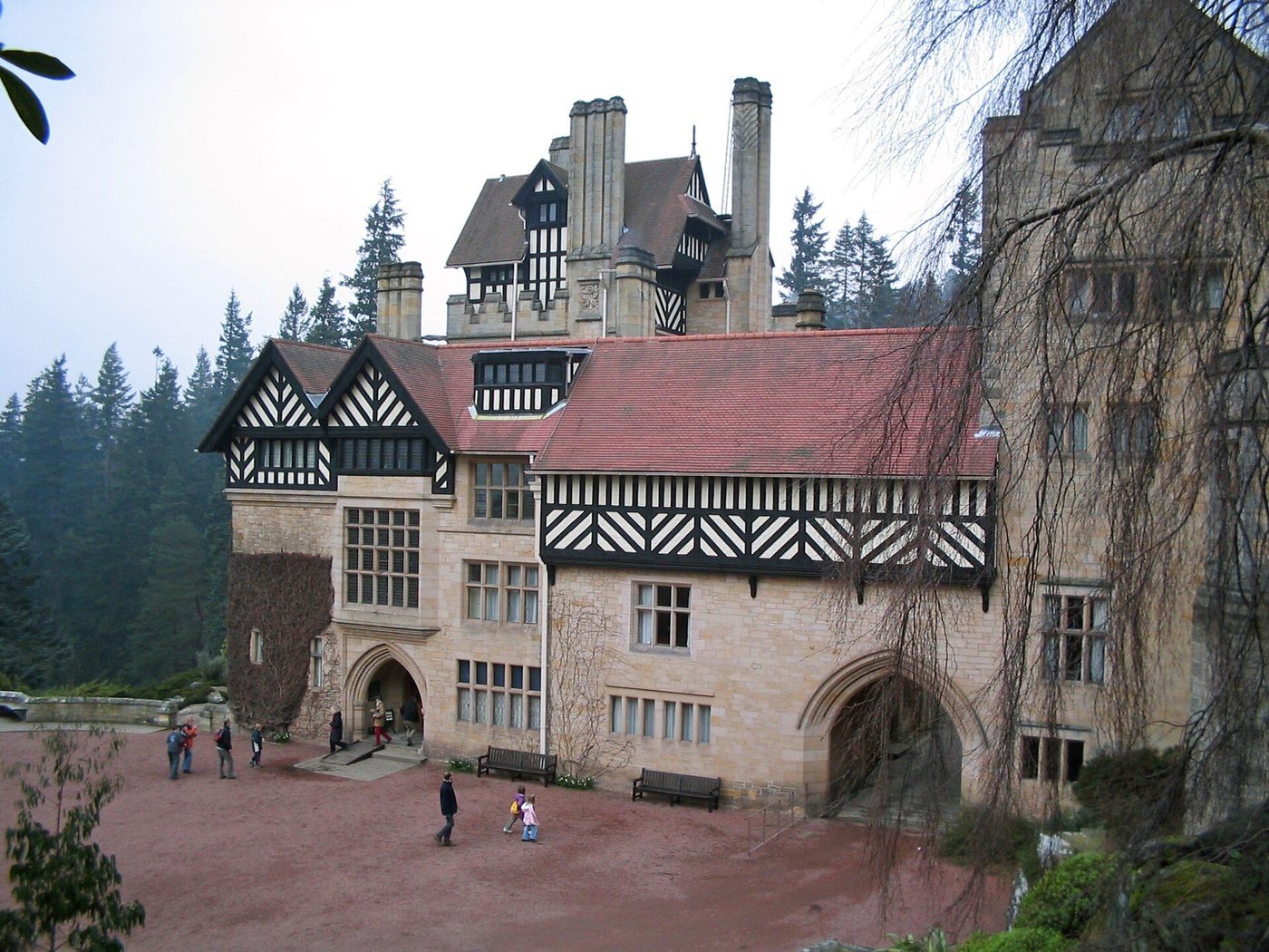 Cragside from below: Shaw's half-timbered and stone house rising from its planted crag above the Debdon Burn