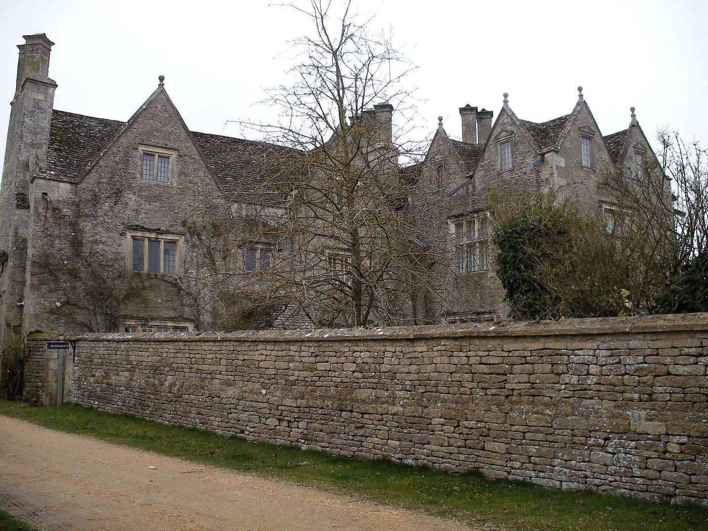 Kelmscott Manor from the lane: the Cotswold stone gables of the house Morris called a 'textile' of the landscape