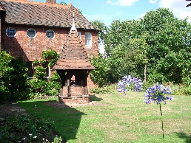 The Red House at Bexleyheath from the garden: Webb's red-brick house and the well house Morris's circle decorated