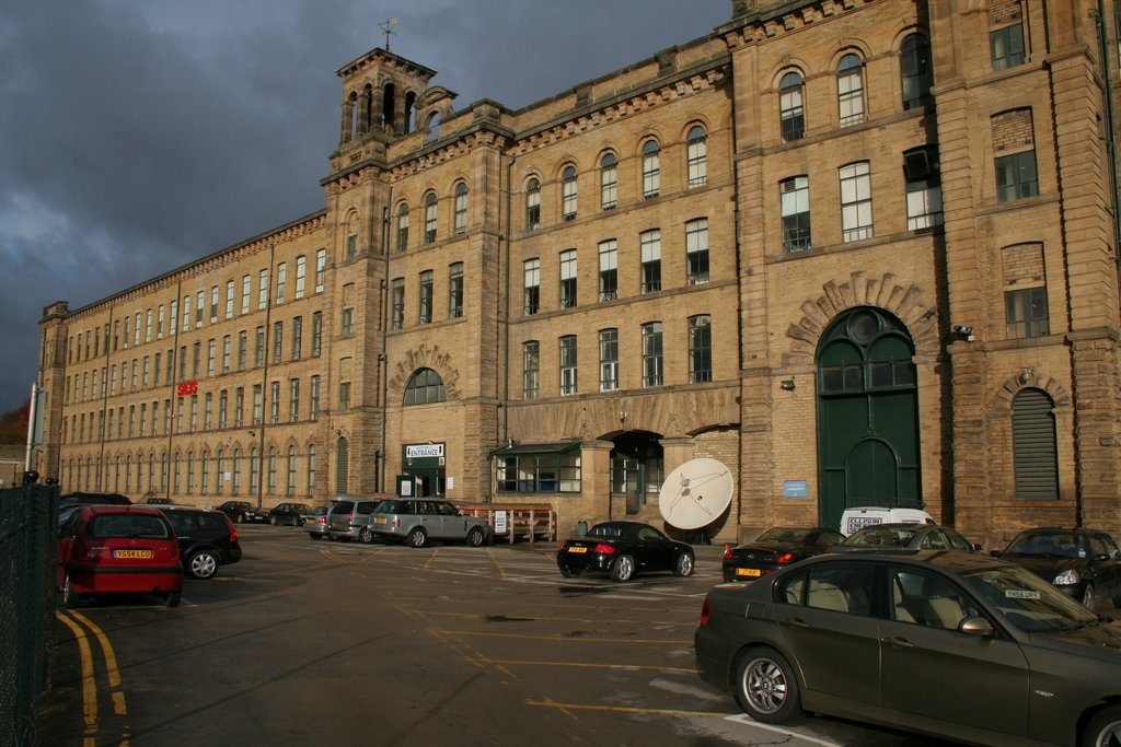 Salts Mill at Saltaire: the vast stone mill front with its Italianate chimney and campanile