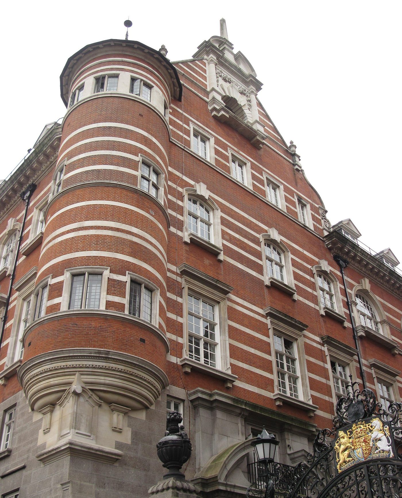 New Scotland Yard on the Victoria Embankment: Shaw's striped red-brick and stone facade with its corner turret